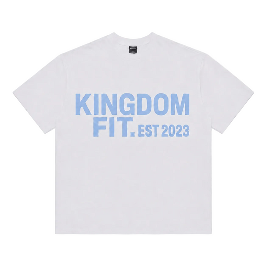 A white short-sleeve crewneck t-shirt with 'KINGDOM FIT. EST 2023' printed in light blue across the chest, displayed flat against a white background.