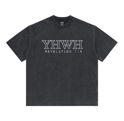 A washed black short-sleeve t-shirt with 'YHWH REVELATION 1:8' printed in white outline text across the chest, displayed flat against a solid white background.